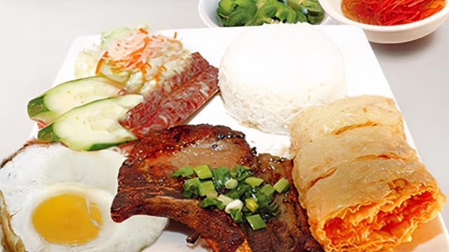 67. Fried Shrimp Cake, Chinese Sausage, Pork Chop & Egg Over Rice / Cơm Đặc Biệt.