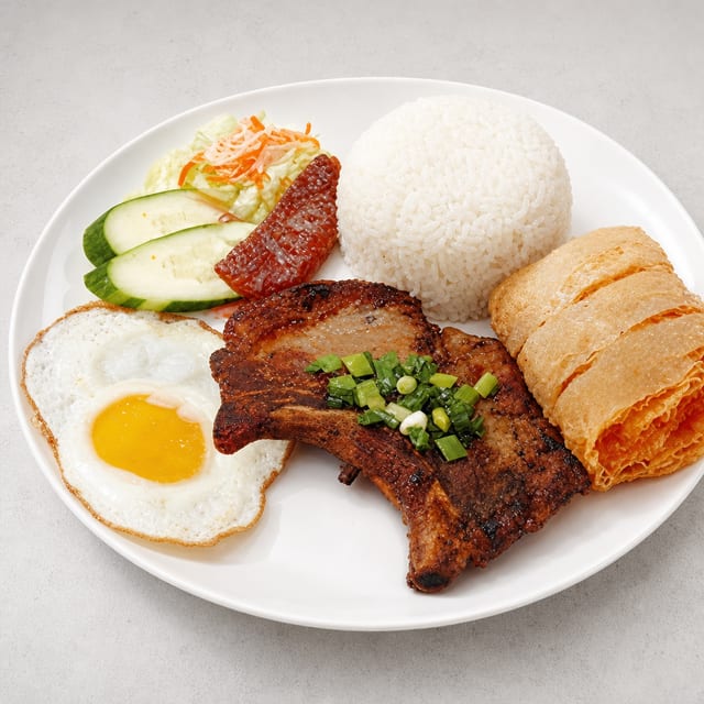 67. Fried Shrimp Cake, Chinese Sausage, Pork Chop & Egg Over Rice / Cơm Đặc Biệt.