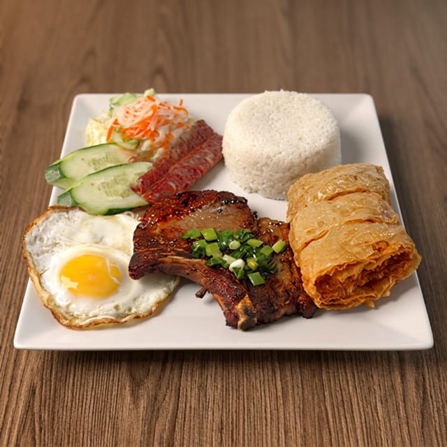 67. Fried Shrimp Cake, Chinese Sausage, Pork Chop & Egg Over Rice / Cơm Đặc Biệt.
